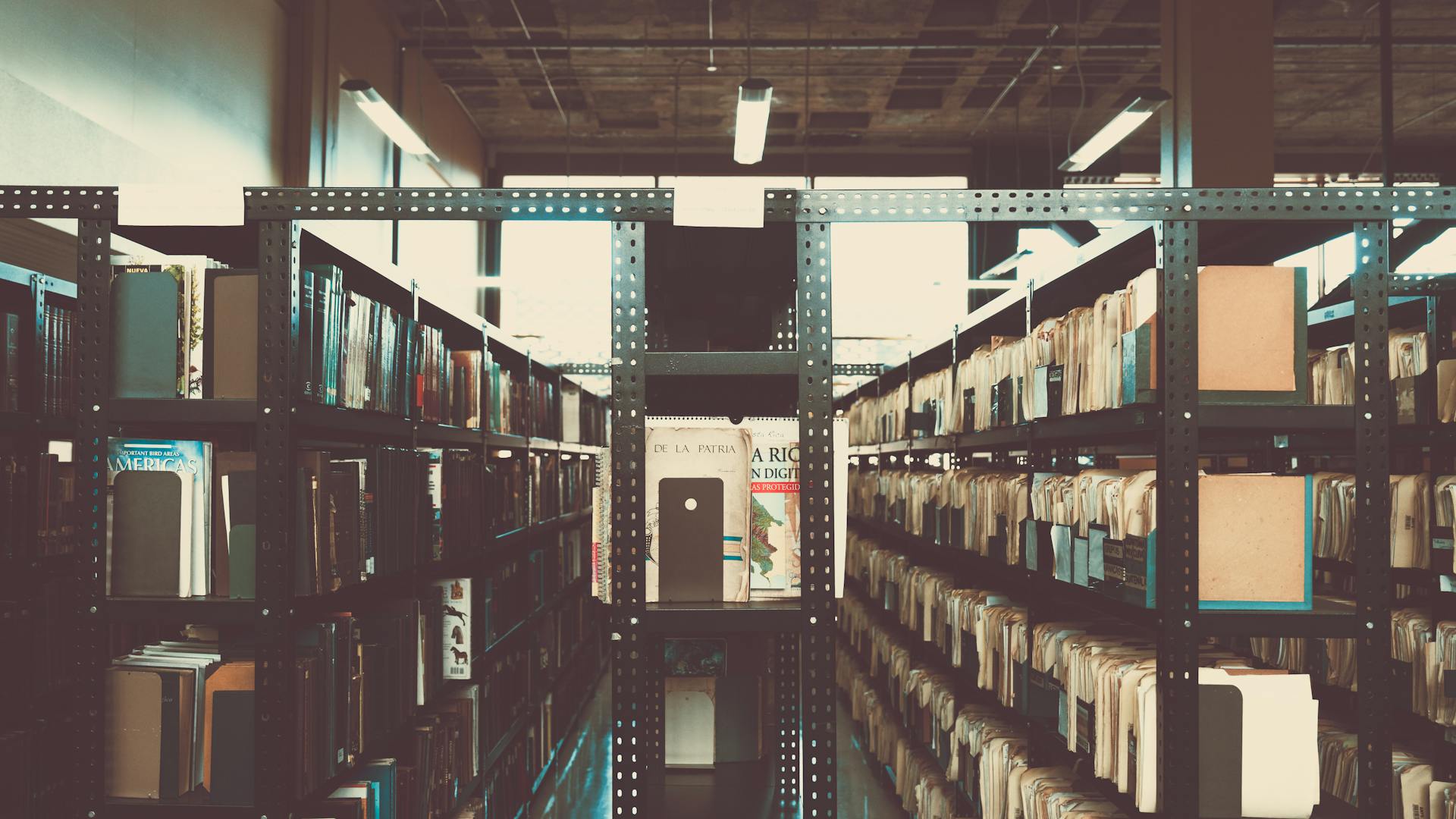 Bookshelves in a library with a vintage tone in San José, Costa Rica.